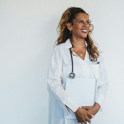 Sofia Kravchuk a professional yoga practitioner smiling in a peaceful environment.