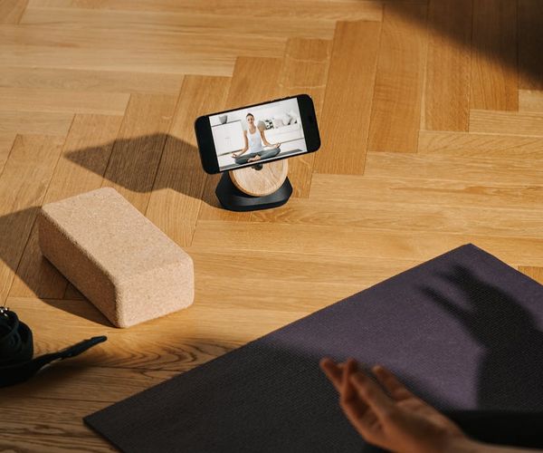 Sunlight streaming onto a yoga mat with a focus on peace and stability.